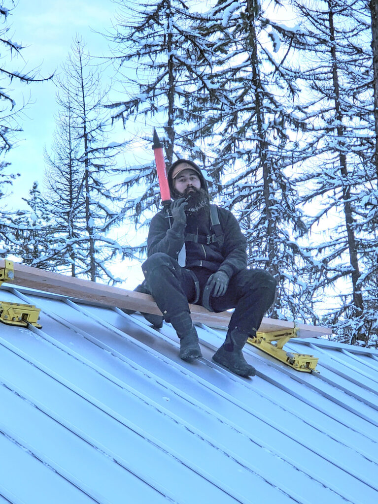 a-roofer-in-his-natural-perch a-roofer-in-his-natural-perch