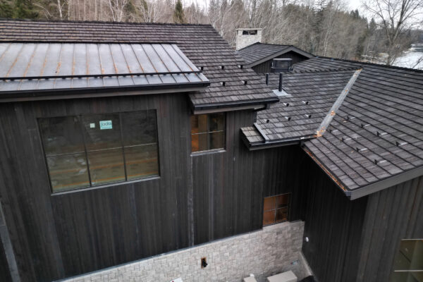 cedur-shake-with-rheinzink-gutters-and-downspouts